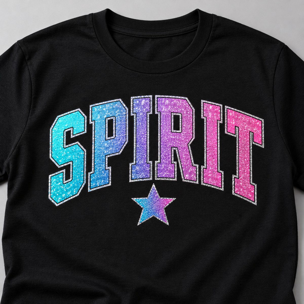 Illustrative Glitter DTF decoration mockup on a black shirt; transfers only, garment not included