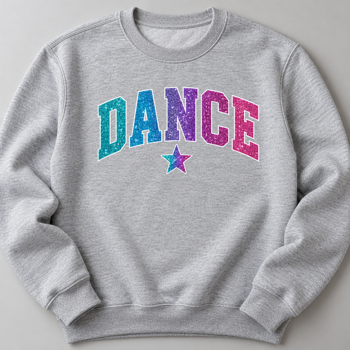 Illustrative decoration mockup: Glitter DTF DANCE design on a gray sweatshirt. Transfers only; garment not included.